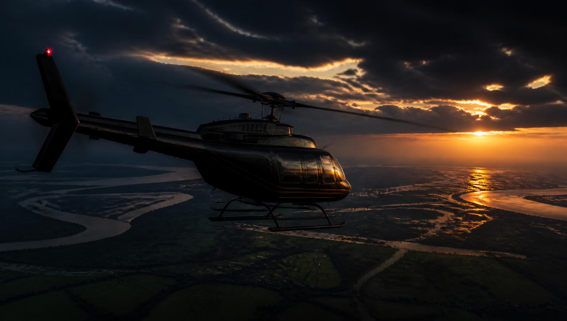 Luxury helicopter flying over the Bangladesh delta at sunset